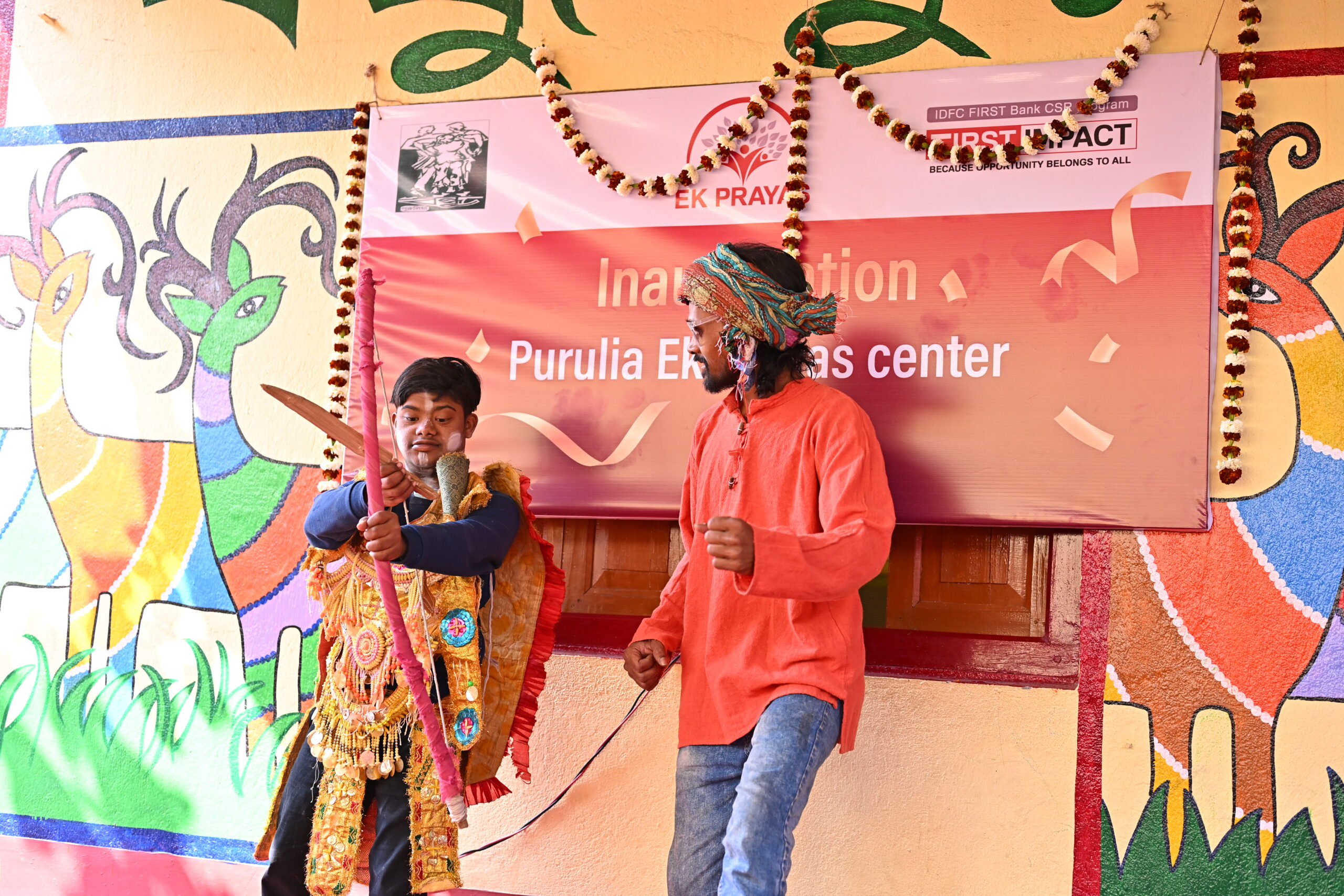 A special child performing Chhau dance with guidance from a dedicated teacher