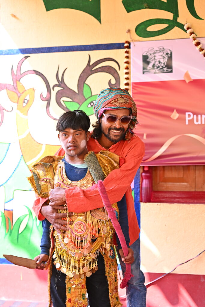 A special child performing Chhau dance with guidance from a dedicated teacher
